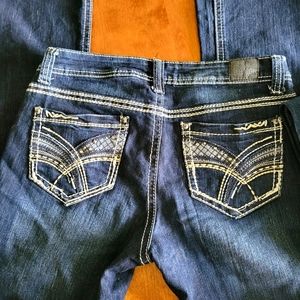 Three pairs of denim blue jeans